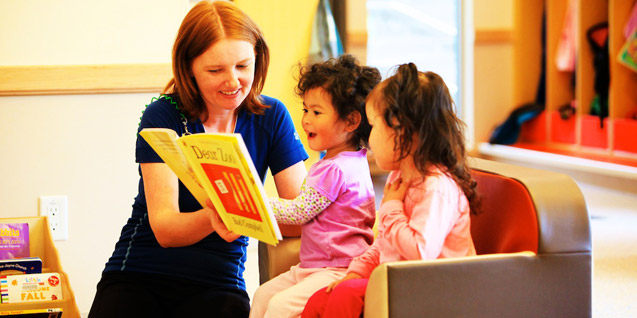 Reading together at the Bob and Kay Ackles YMCA Nanook House